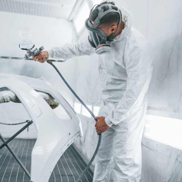 in-protective-mask-painting-the-car-caucasian-au-2021-09-03-02-37-26-utc-1.jpg